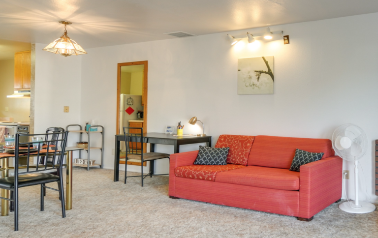 living room with couches and ROKU television